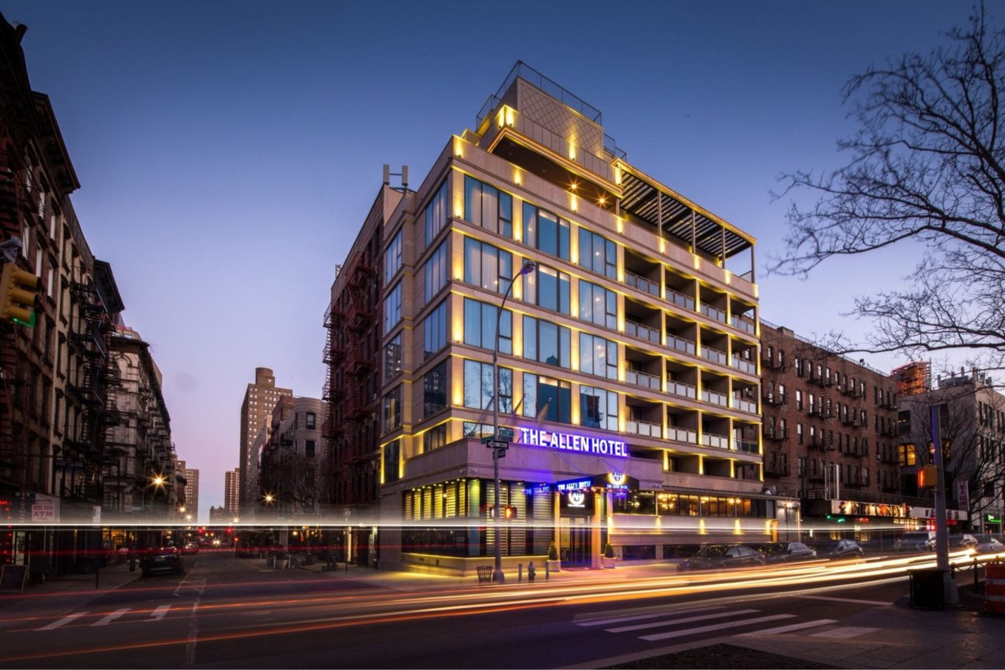 THE HOTEL. Brown concrete building during night time