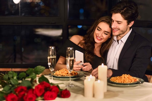 Happy couple celebrating Valentine's Day in a restaurant 
