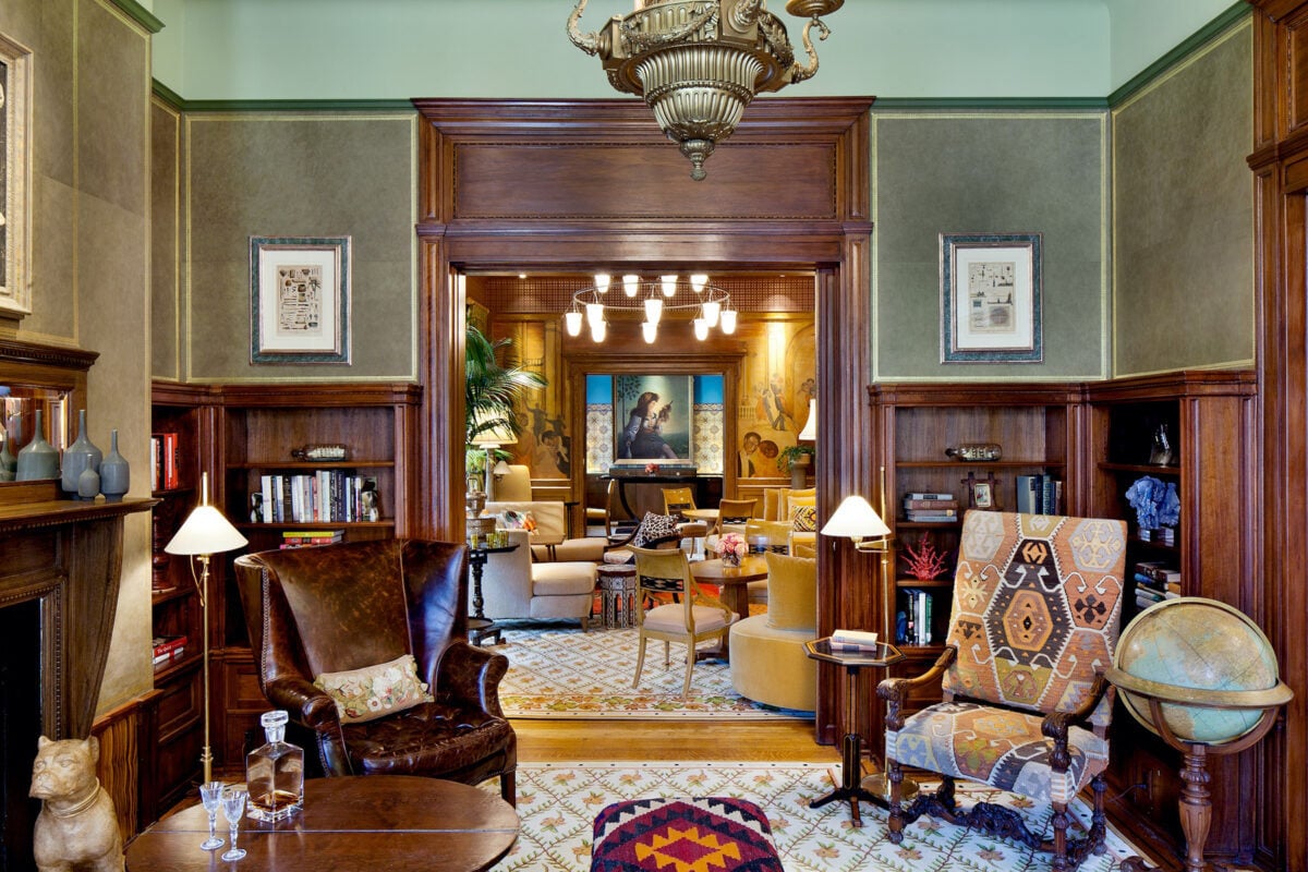 Elegant library lounge with wood paneling at The Ivy Hotel in Baltimore