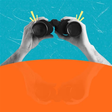 person holding binoculars 