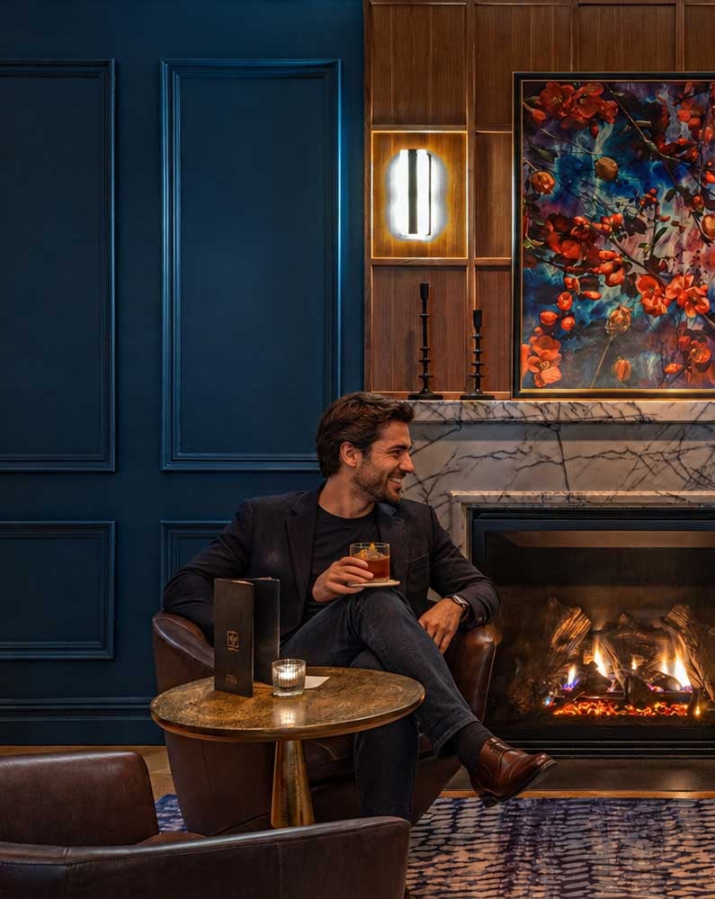 Guest seated in the lounge at The Wallace Hotel